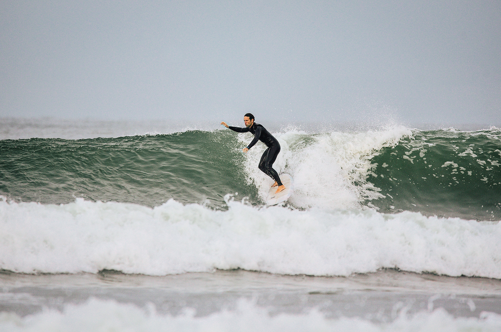 Brian Behrens catching a wave at Sunset Point along the PCH in Los Angeles, CA